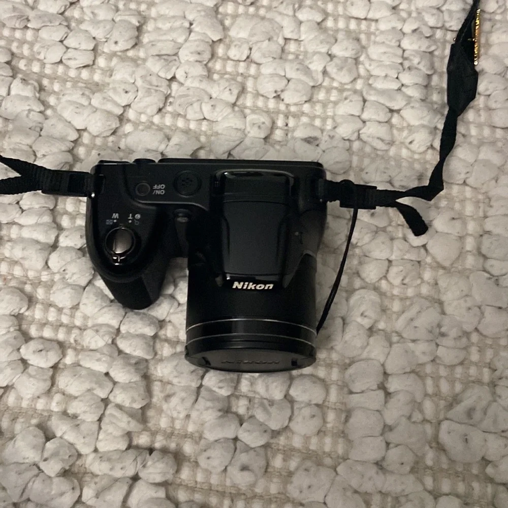 Black Nikon coolpix digital camera